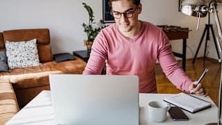 man s laptop smiling gettyimages .jpg
