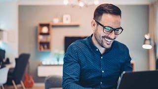 man s smiling laptop gettyimages .jpg