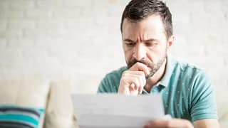 man looking at paper xyEv.width iqZdI.jpg