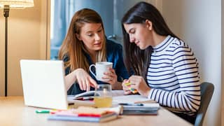 mom and teen daughter do homework.width .jpg