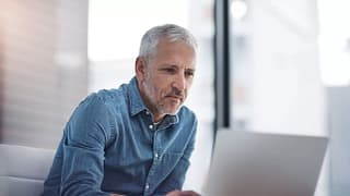 older man at laptop gettyimages .jpg