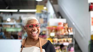 senior a smiling person in an apron gettyimages .jpg