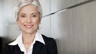 woman older gray hair suit gettyimages .jpg