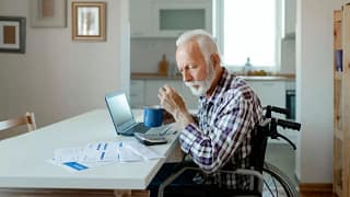 Older gentleman in wheelchair sits at kitchen.width PVLhTY.jpg