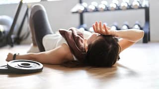 Person resting on floor in room filled with w.width .jpg