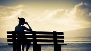 Silhouette upset woman on bench GmhxL.width .jpg