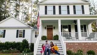 family on home steps.width .jpg