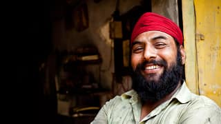 getty happy smiling sikh with beard.jpg