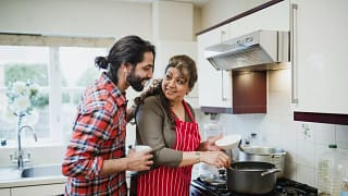 mother with adult child cooking TwZGVpz.width .jpg