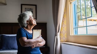 mourning loved one holding picture frame.jpg