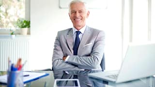 older man suit smiling gettyimages .jpg