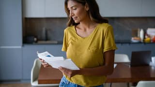 person opening mail and smiling SCSHeUC.width .jpg
