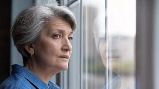 stressed senior looking out window.jpg