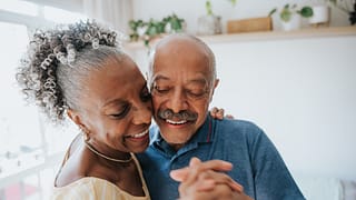 two older people dancing together and smiling.jpg