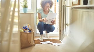 woman opening mail.width .jpg