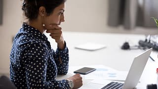 worried woman with laptop.width .jpg