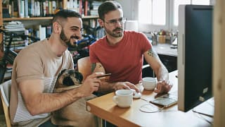 Two men shopping online credit card INXVtBn.width .jpg
