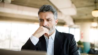 older business suit a person at a laptop.jpg