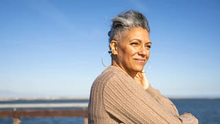 smiling person looking out over the ocean.jpg