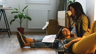 two women sitting on floor.width .jpg