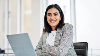 woman s a smiling person at a laptop gettyimages .jpg