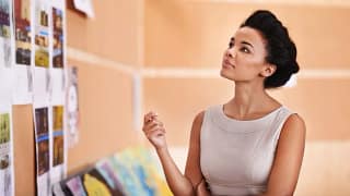 woman in office looking thoughtful fjpkE.width .jpg