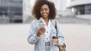 young person using smart phone on a city street.jpg
