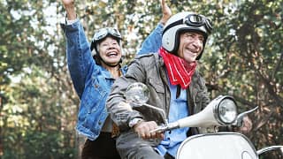Retirees on a moped TMpuav.width .jpg