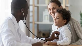 child and mom at doctor.width .jpg