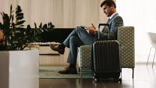 man relaxing in airport lounge TEatp.width .jpg