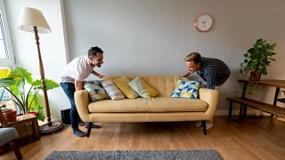 two people moving couch ctnOac.width .jpg