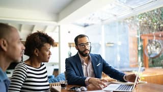 Couple speaking with professional male who sh.width cYWXh.jpg