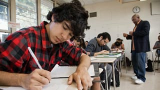Male teacher interacts with classroom of high.width MjvQjW.jpg