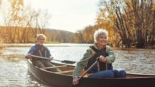 Mature couple rowing together in a canoe aaF.width .jpg