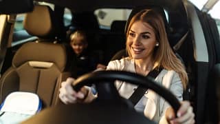 Mother driving car with young child in car se.width .jpg