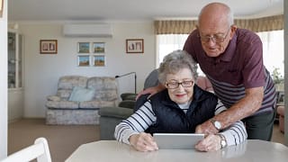 couple looking at tablet together.jpg