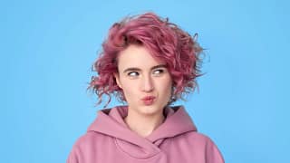 getty pink hair thinking looking to side.jpg