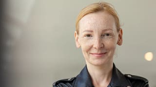 getty smiling looking at camera black shirt.jpg
