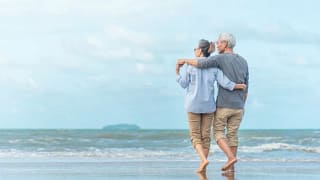 older couple walking beach.width .jpg