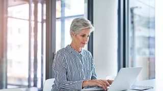 woman older laptop gettyimages .jpg