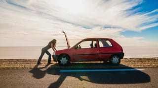 woman standing on the side of the road lookin.width iCnnai.jpg