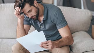 Upset man with bills.width .jpg