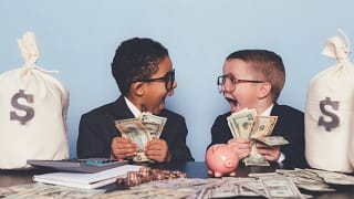 getty children kids amazed money getting rich get rich dollars.jpg