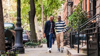 two men walking down street.width .jpg