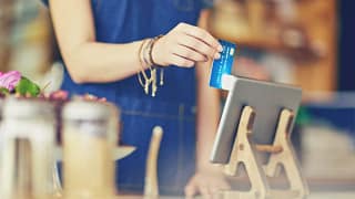 cashier swiping credit card YhXzHx.width .jpg