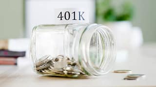 getty images k savings jar tipped over half empty.jpg
