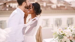 newlywed wedding couple bride groom kiss happy veil wedding dress x aae.jpg