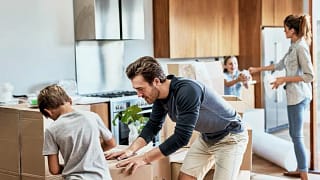 parents and kids packing moving boxes.width .jpg