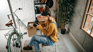 woman with camera and bike inside.width .jpg