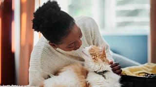 Person giving their pet cat affection. CuGSlY.width .jpg